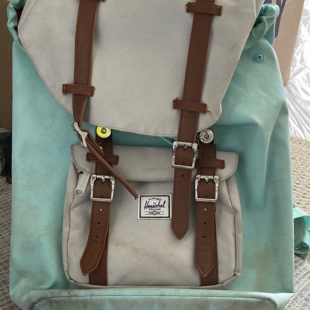 Cute teal color with leather trim